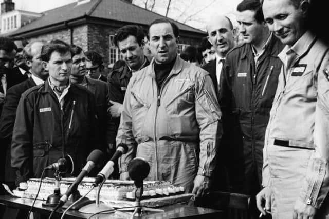Test pilot Brian Trubshaw (centre), with his co-pilot John Cochrane (right) and his French counterpart Andre Turcat (behind, right), speaking at a press conference following his successful first flight of the Concorde 02 airliner, at RAF Filton, England, April 9 1969. (Photo by George W. Hales/Fox Photos/Getty Images)
