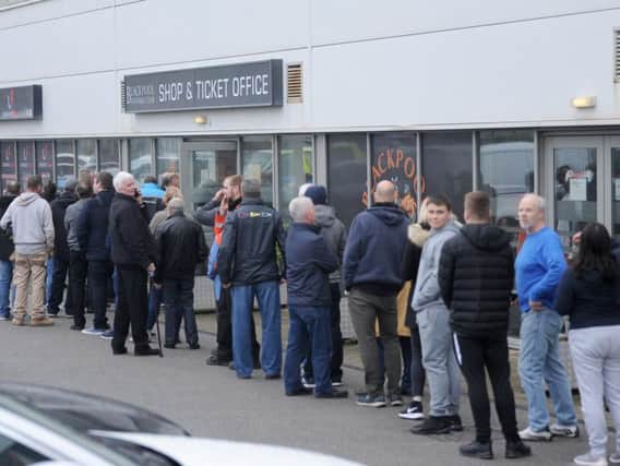 Fans continue to queue outside Bloomfield Road for tickets
