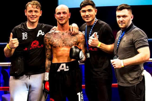 Adam Little celebrates victory with his team. Picture: Kevin Gilbo\Eat Sleep Boxing Repeat