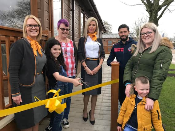 Julie Robinson from Thomas Cook, Karima  (age 9), whose sister attends Derian House, his mum Jo Taleb, Gina Robertson from Thomas Cook, Bolton Wanderers Footballer and Derian Ambassador Jason Lowe, Emma Doherty and her son Bobby Baldwin (age 3)