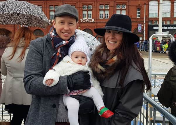 Andy Tracey, who runs the Mini-Links golf course at St Annes, with wife Stacey and seven month old baby Alma as they wait to greet the Duke and Duchess of Cambridge, with whom Andy attended St Andrew's University, on their visit to Blackpool