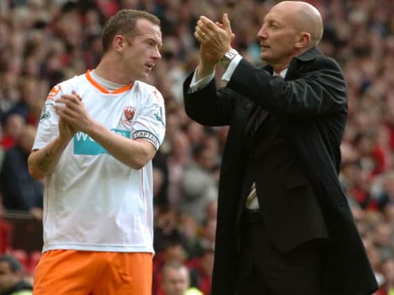 Ian Holloway applauds the Blackpool fans at Old Trafford in 2011