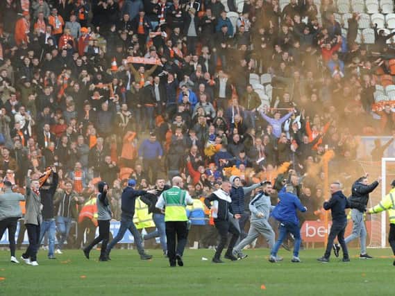 Fans invaded the pitch after Blackpool's stoppage time equaliser