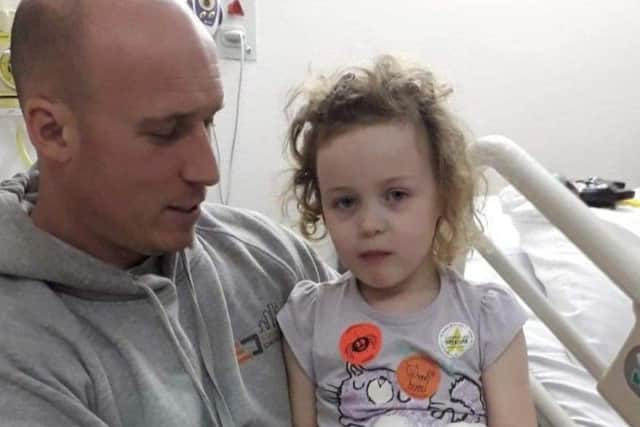 Mille and dad Scott in hospital