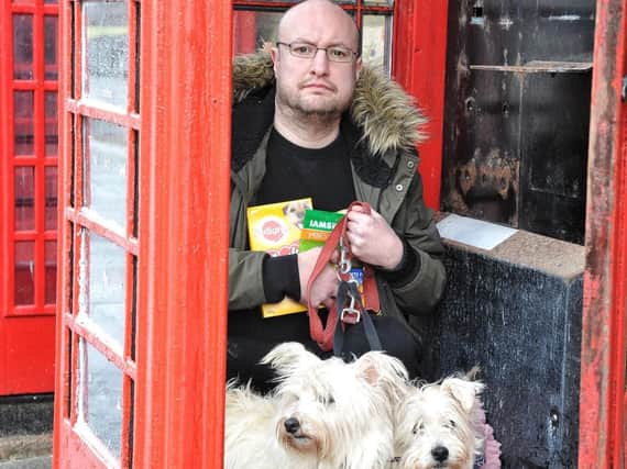 Craig Brown at the telephone box in Abingdon Street where he wanted to open a retail business for pet owners