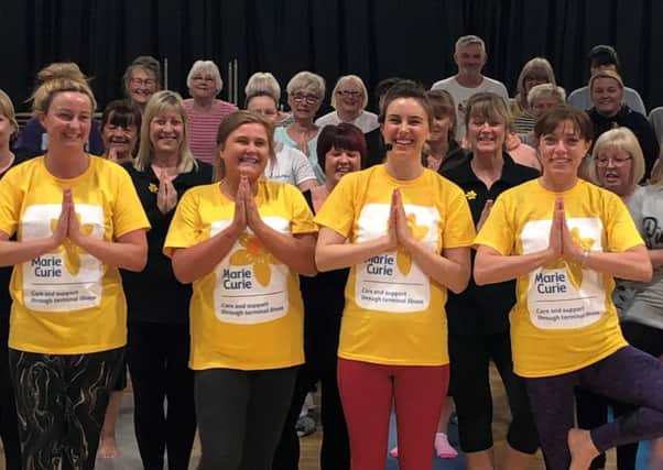Kayleigh Cooper runs yoga sessions for all at Highfield School in Blackpool, and is raising money throughout March for Marie Curie