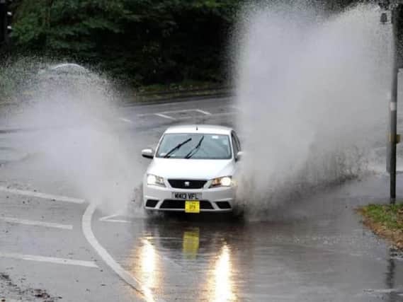 Wet and windy conditions are causing problems for motorists across Lancashire this morning.