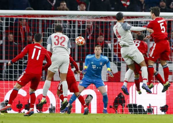 Virgil van Dijk heads home at the Allianz Arena as Liverpool became the fourth English team to win through to the Champions League quarter-finals