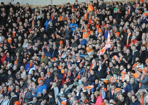 All together now: Blackpool fans packed Bloomfield Road to the rafters on Saturday