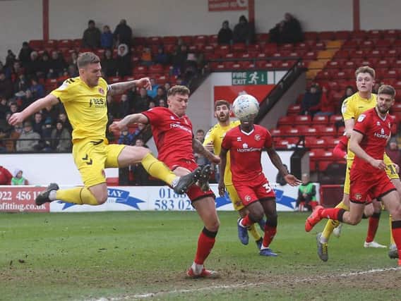 Ash Eastham has a strike on goal for Fleetwood Town at Walsall