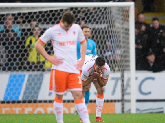 Blackpool's players react to Burton Albion's third goal of the day