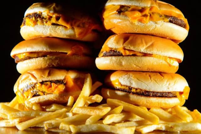 Junk food adverts on TV and online could be banned before 9pm as part of Government plans to fight the "epidemic" of childhood obesity. Photo: Dominic Lipinski/PA Wire