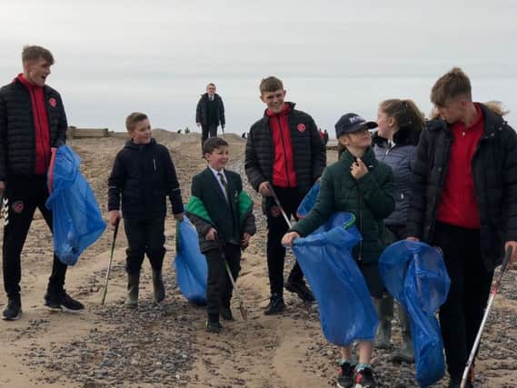 Towns U18s joined pupils from Shakespeare Primary School in litter picking on Fleetwood beach.
