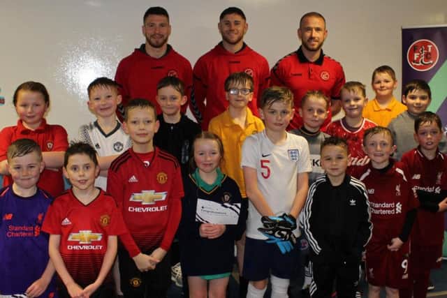 Paddy Madden, Wes Burns and James Husband joined in the Premier League Primary Stars football training session at Larkholme Primary.Photo credit: FTFC