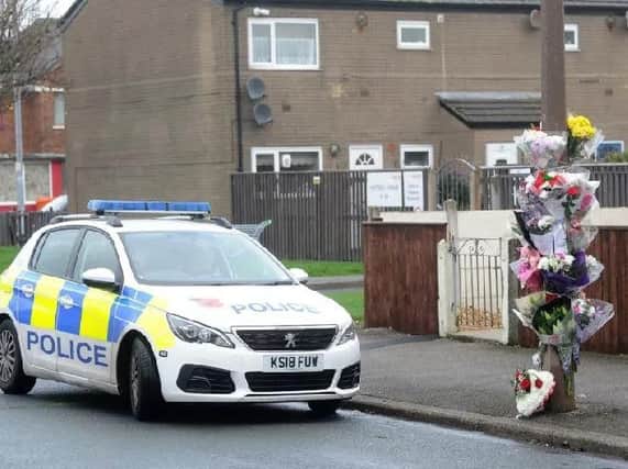 Tributes and flowers left on Broomfield Road for Michael Hart