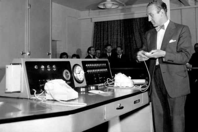 Ernest Marples, the then Postmaster-General, pressing a button to start up ERNIE (Electronic Random Number Indicating Equipment) for the first Premium Savings Bonds draw, at St Annes, on June 1, 1957