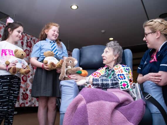 Elouise O'Loughlin and Abbie Waters with patient Hilda Olding and Cathy Whittaker from Trinity Hospice