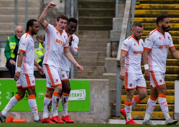 Matty Virtue celebrates his goal in Blackpools emphatic victory at Bradford City