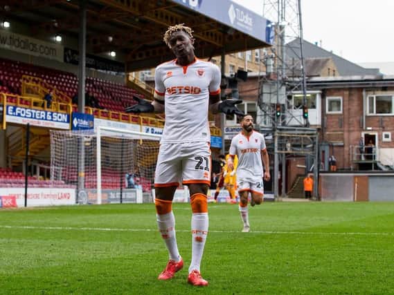 Armand Gnanduillet celebrates the second of his superbly-taken headers