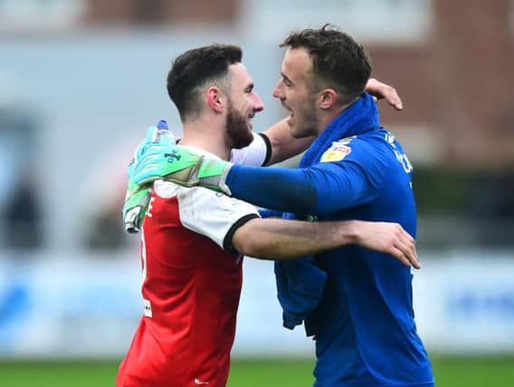 Alex Cairns celebrates Fleetwood's latest clean sheet with Lewie Coyle