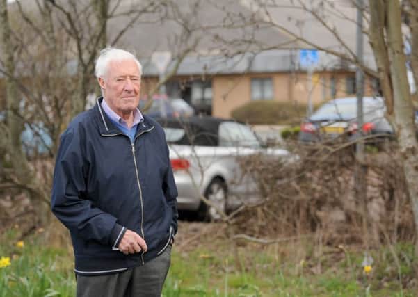 Resident Graham Hunt at the area of concern overlooking Clifton Hospital