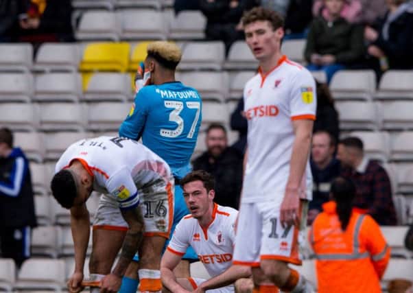 Blackpools players show their disappointment after conceding a late goal at Bradford City