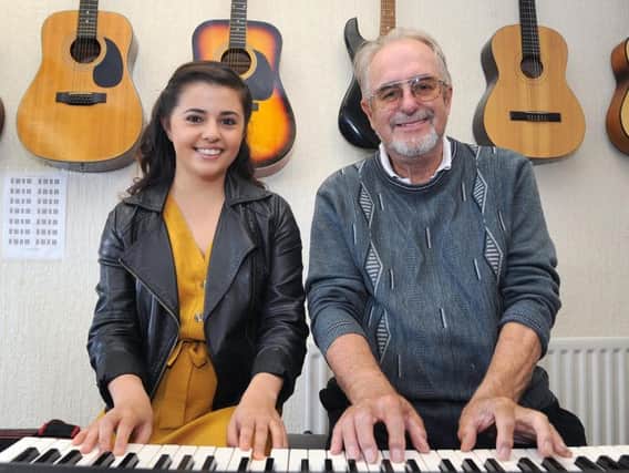 Former student Caroline Cooper with music academy founder John Shaw