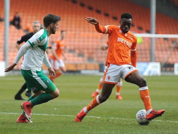 Marc Bola in the thick of the action against Plymouth