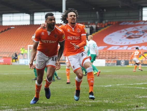 Curtis Tilt celebrates his stoppage-time equaliser for Blackpool with Nya Kirby