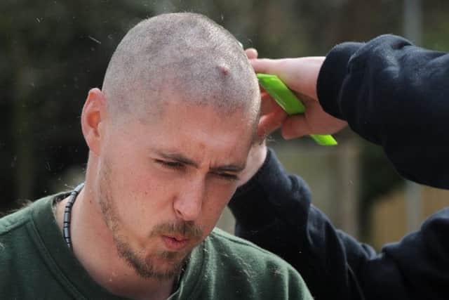 Barber Simon Reeves getting rid of of Blackpool Zoo worker Dom Ricchuiti on Saturday afternoon