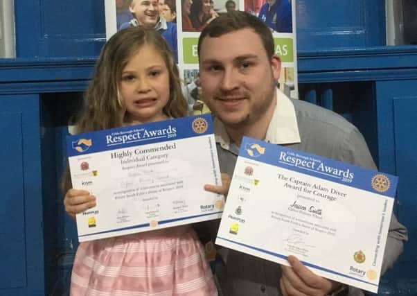 Jessica Smith and dad Kyle with Jessica's awards for saving his life