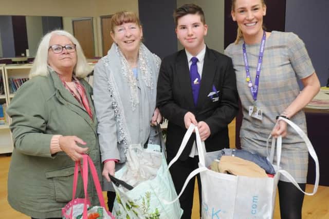 Carole Cox and Linda McEvilly from Care and Share with pupil Sally Moorhouse and teacher Lesley Gregory