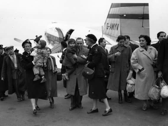 Hungarian refugees arrive in the UK, on November 17, 1956 and are met at Blackbushe Airport by Social Workers. (Photo: Keystone/Getty Images)