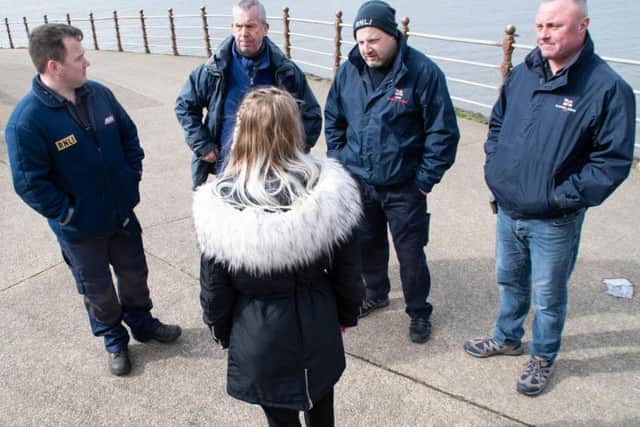 Shelby Burns thanks members of the RNLI for saving her life.