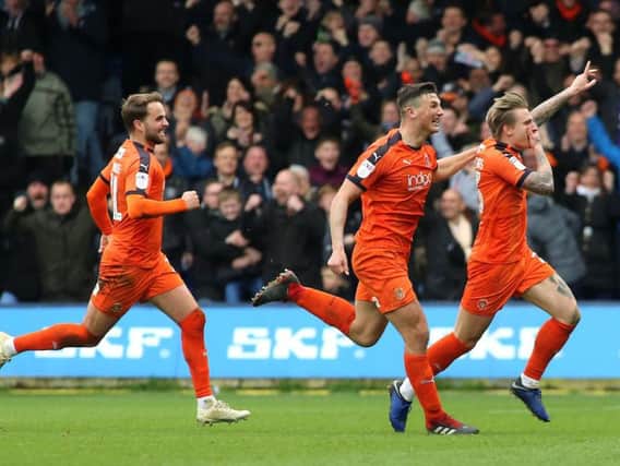 Jason Cummings celebrates after scoring an 86th-equaliser for Luton