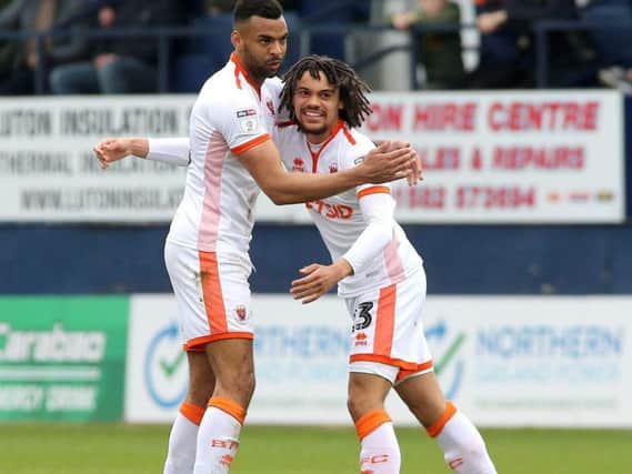 Blackpool scorer Nya Kirby (right) is congratulated by Curtis Tilt