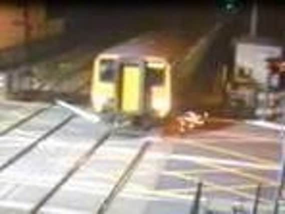 Dramatic footage shows a Northern service crashing into a loose safety barrier at Carleton Crossing in Blackpool Road, Poulton at 1.30am on Monday, April 8.