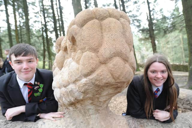 Unveiling of a new snake sculpture at Beacon Fell Country Park.  Liam Wilkinson and Nisha Gardner from Cardinal Allen.