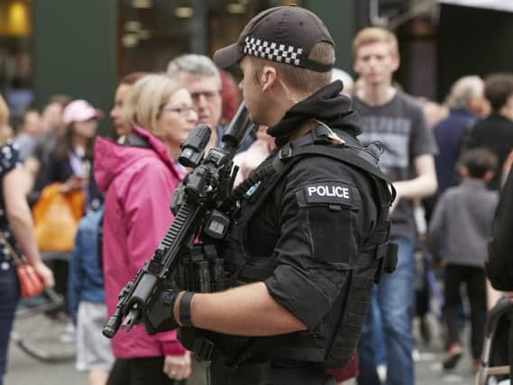 An armed police officer on the streets of Manchester