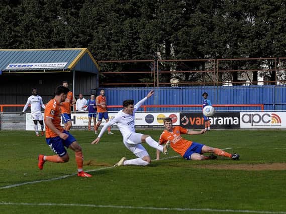 Jordan Tunnicliffe slides in to score what proved a consolation goal for Fylde Picture: STEVE MCLELLAN