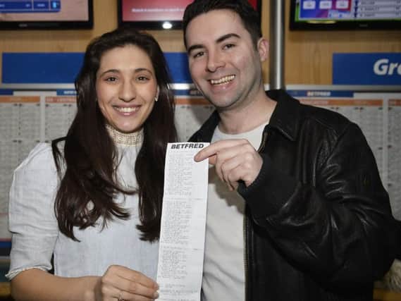 Craig and fiancee Harriet with his winning betting slip.