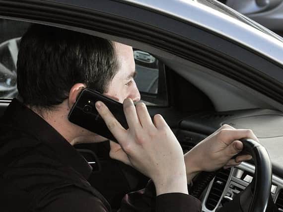 Police introduce detectors to stop drivers using mobile phones