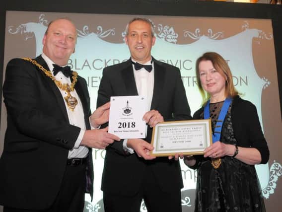 Blackpool Mayor Gary Coleman presents Darren Webster, boss of Blackpool Zoo, with their prize along with Joan Humble