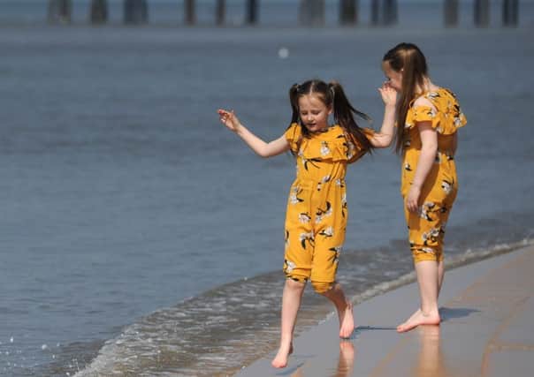 Hot weather is forecast over the Easter bank holiday weekend.  Sisters Carla Jackson, 8 and Annabelle Jackson, 6.