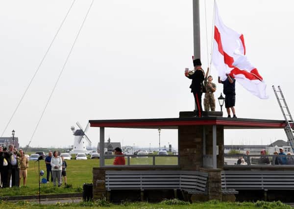 The raising of the flag at Charlies Mast on Lytham Green