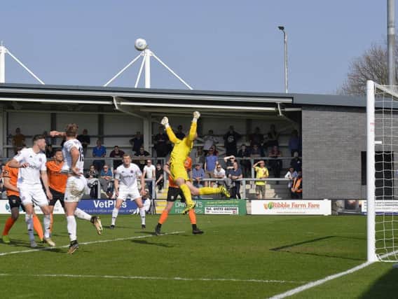 Nick Haughton's cross is punched clear by Barnet keeper Mark Cousins  Picture: STEVE MCLELLAN