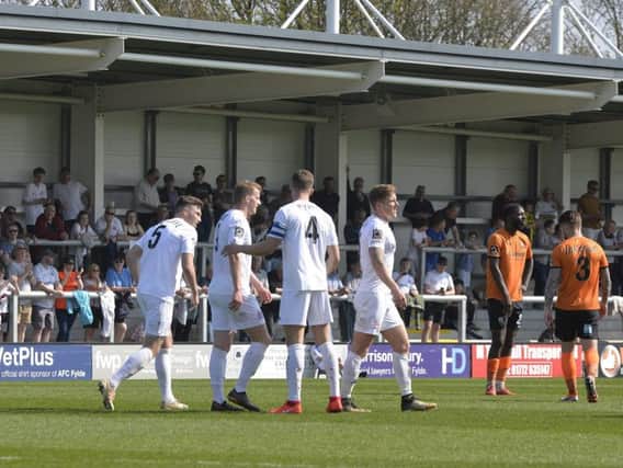Fylde celebrate Danny Rowe's winner against Barnet Picture: STEVE MCLELLAN