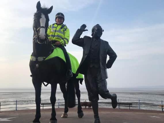 Morecambe the police horse next to the Eric Morecambe statue in Morecambe. Credit: Lancs Police Mounted