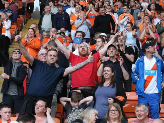 Supporters enjoy the big-match atmosphere at Bloomfield Road