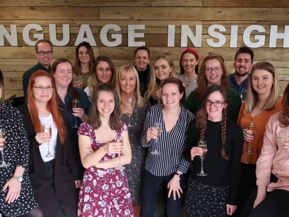 The team from Language Insight is celebrating winning a Queen's Award
